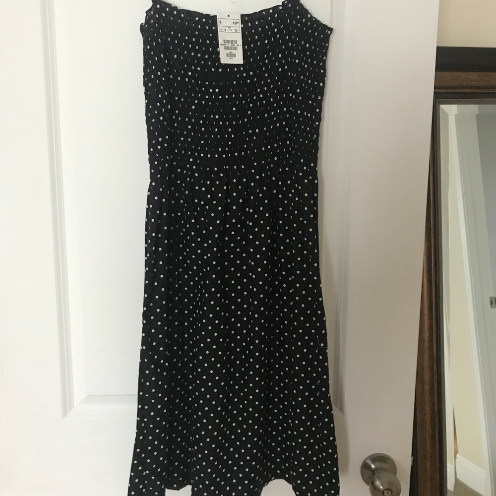 Black polka-dot dress with tie straps.
